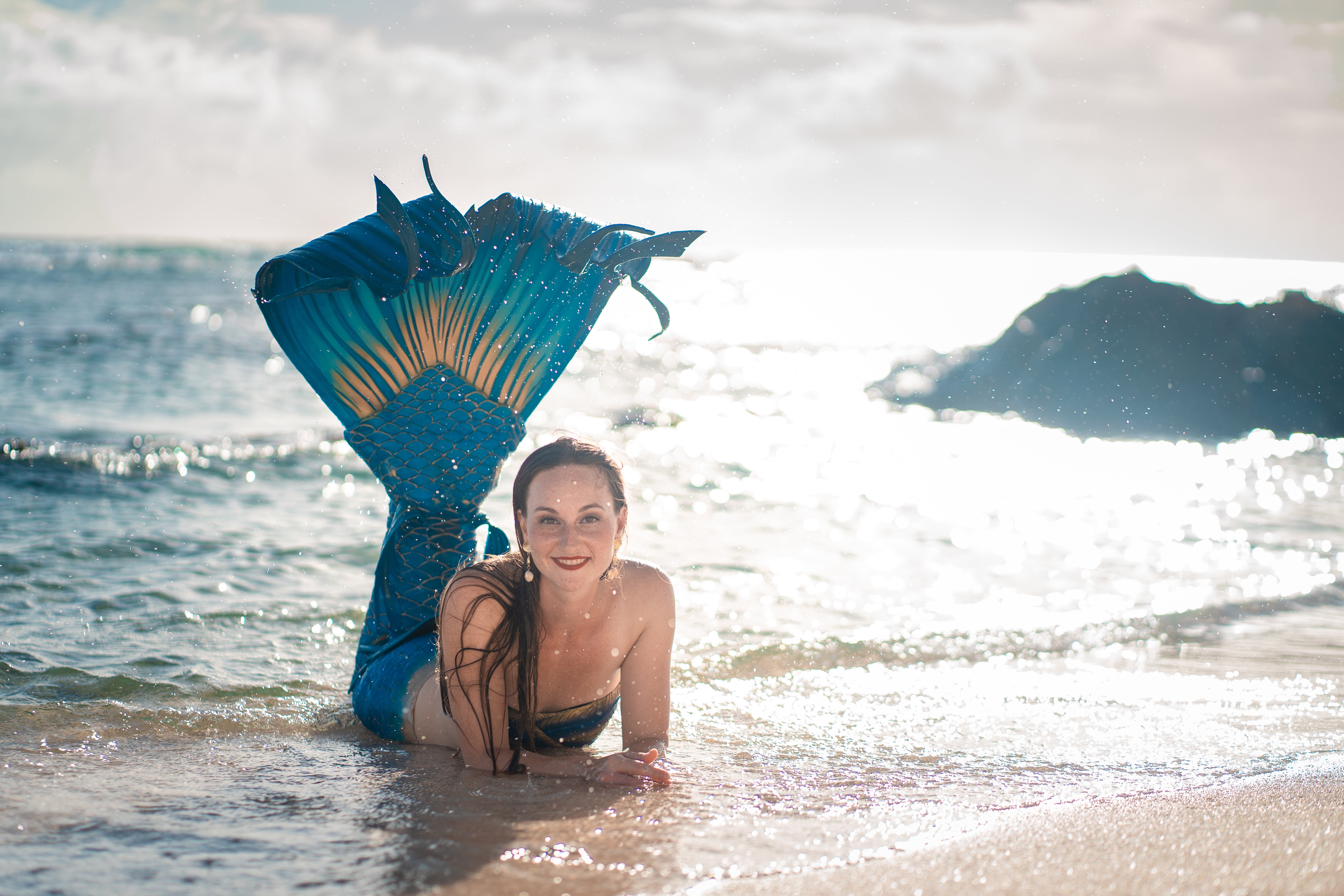 Mermaid in golden surf