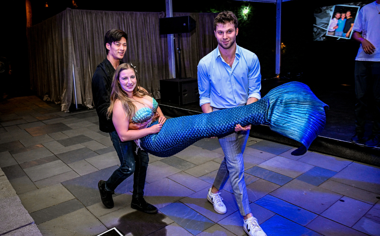Blue metallic silicone mermaid tail at event