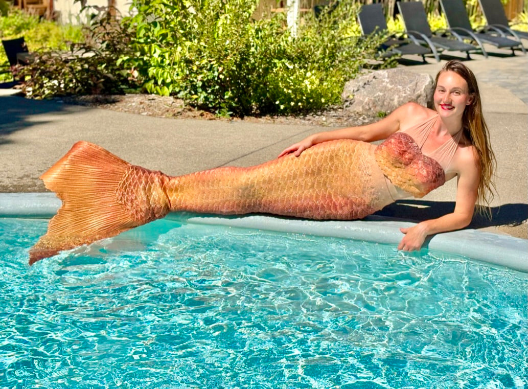 Gold silicone mermaid tail at poolside